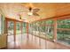 Beautiful sunroom with hardwood floors, wood ceiling and views to the backyard at 3603 Cr 626N, Bushnell, FL 33513