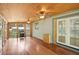 Light-filled sunroom featuring hardwood floors, wood ceiling and French doors at 3603 Cr 626N, Bushnell, FL 33513