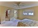 Spacious bedroom with a bed and en-suite bathroom access at 8872 Sw 92Nd Pl # E, Ocala, FL 34481