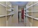 Walk-in closet with multiple tiers of shelving to maximize storage at 8872 Sw 92Nd Pl # E, Ocala, FL 34481