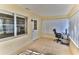 Sun-drenched Florida room with tiled floor and workspace at 8872 Sw 92Nd Pl # E, Ocala, FL 34481