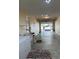 A well-lit garage with laundry appliances, a utility sink, and an open garage door leading to the driveway at 8872 Sw 92Nd Pl # E, Ocala, FL 34481