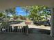Scenic neighborhood view showcases mature trees and well-maintained landscaping in a peaceful setting under a blue sky at 8872 Sw 92Nd Pl # E, Ocala, FL 34481