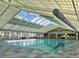 Bright indoor pool featuring large windows, ample lighting, and a clean, modern design, inviting year-round swimming at 8872 Sw 92Nd Pl # E, Ocala, FL 34481