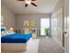 Cozy bedroom with a blue bedspread and plenty of closet space at 582 Caledonia Pl, Sanford, FL 32771