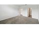 Carpeted bedroom with ensuite bathroom and walk in closet at 1122 James Paul Rd, Davenport, FL 33837