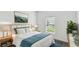 Comfortable bedroom with soft lighting, a calming color scheme, and stylish decor at 1122 James Paul Rd, Davenport, FL 33837