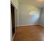 Light bedroom with wood-look floors and mirrored closet at 431 Bay Leaf Dr, Kissimmee, FL 34759