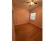 Bright bedroom with light pink walls and wood-look flooring at 431 Bay Leaf Dr, Kissimmee, FL 34759