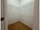 Walk-in closet with wire shelving for convenient storage at 431 Bay Leaf Dr, Kissimmee, FL 34759