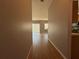 Light and bright hallway with wood-look flooring, leading to living areas at 431 Bay Leaf Dr, Kissimmee, FL 34759