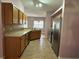 Kitchen with wood cabinets, stainless steel appliances at 431 Bay Leaf Dr, Kissimmee, FL 34759