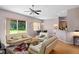 Living room with light beige couches and view of backyard at 431 Bay Leaf Dr, Kissimmee, FL 34759