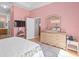 Main bedroom with a dresser and a comfortable bed at 431 Bay Leaf Dr, Kissimmee, FL 34759