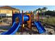 Community playground with slides and climbing structures at 431 Bay Leaf Dr, Kissimmee, FL 34759