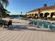 Resort-style pool with lounge chairs and patio tables at 431 Bay Leaf Dr, Kissimmee, FL 34759