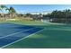 Tennis court near pond, offering scenic views at 431 Bay Leaf Dr, Kissimmee, FL 34759