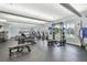 Well-equipped fitness center with modern exercise machines, weights, and ample natural light for residents at 8311 Foster Dr, Davenport, FL 33896