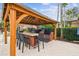 Outdoor kitchen area featuring a pergola, built-in grill, and seating for community gatherings and cookouts at 8311 Foster Dr, Davenport, FL 33896