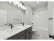 Modern bathroom with double vanity and a shower/tub combo at 3057 Bootlace Way, Saint Cloud, FL 34771