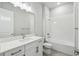 Clean bathroom with a single vanity and bathtub at 3068 Bootlace Way, St Cloud, FL 34771