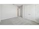 Spacious bedroom with grey carpet and double door closet at 3068 Bootlace Way, St Cloud, FL 34771