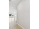 Bright and spacious hallway with light walls and wood-look flooring at 3068 Bootlace Way, St Cloud, FL 34771