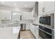 Sleek kitchen design with stainless steel appliances and white cabinetry at 3068 Bootlace Way, St Cloud, FL 34771