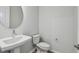 Powder room featuring a pedestal sink and toilet, painted in a neutral color at 3051 Bootlace Way, St Cloud, FL 34771