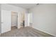 Bright bedroom featuring a closet and connecting bathroom with gray carpet flooring at 3051 Bootlace Way, St Cloud, FL 34771