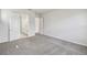 Bedroom with view into bathroom with double vanity and separate water closet at 3051 Bootlace Way, St Cloud, FL 34771