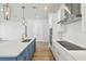 Sleek kitchen with an island sink, white subway tile backsplash, and stainless steel appliances at 3051 Bootlace Way, St Cloud, FL 34771