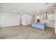 Open floor plan with kitchen featuring a blue island and stainless steel appliances at 3051 Bootlace Way, St Cloud, FL 34771
