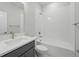 The bathroom features modern fixtures, a sleek vanity, and a shower-tub combination at 3062 Bootlace Way, St Cloud, FL 34771