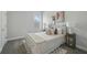 This bedroom features a cozy rug, soft lighting, and a comfy bed at 3062 Bootlace Way, St Cloud, FL 34771
