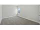 A quiet bedroom bathed in neutral tones with a single window for natural light at 3062 Bootlace Way, St Cloud, FL 34771
