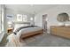 Serene bedroom with neutral tones, a comfortable bed, and an ensuite bathroom at 3062 Bootlace Way, St Cloud, FL 34771