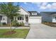 Charming single-story home with a well-manicured lawn, covered porch, and a two-car garage at 3062 Bootlace Way, St Cloud, FL 34771