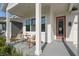 Cozy front porch with comfortable seating, creating a welcoming entrance to the home at 3062 Bootlace Way, St Cloud, FL 34771