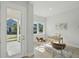 Bright home office with stylish furnishings, natural light, and a view of the front yard at 3062 Bootlace Way, St Cloud, FL 34771