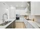 Bright kitchen with stainless steel appliances, sleek countertops, and a contemporary design at 3062 Bootlace Way, St Cloud, FL 34771