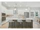 Modern kitchen with a spacious island, stainless steel appliances, and ample cabinet space at 3062 Bootlace Way, St Cloud, FL 34771
