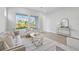 Cozy living room featuring neutral color palette, plush seating, and stylish decor at 3062 Bootlace Way, St Cloud, FL 34771