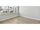 Bright, unfinished room showcasing ample natural light and laminated floor at 3062 Bootlace Way, St Cloud, FL 34771