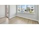 Bright, unfinished room showcasing ample natural light and laminated floor at 3062 Bootlace Way, St Cloud, FL 34771