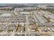 Aerial view of community with houses, roads, and a pond at 5753 Wallis Ln, St Cloud, FL 34771