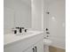 Clean bathroom with white vanity, black fixtures, and shower/tub combo at 5753 Wallis Ln, St Cloud, FL 34771