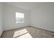 Well-lit bedroom featuring neutral walls and carpet at 5753 Wallis Ln, St Cloud, FL 34771