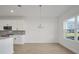 Bright dining area with large window and pendant lighting at 5753 Wallis Ln, St Cloud, FL 34771