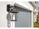 Black exterior light fixture on the side of the house at 5753 Wallis Ln, St Cloud, FL 34771